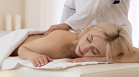 Light haired skinny beauty is having fun with her masseur